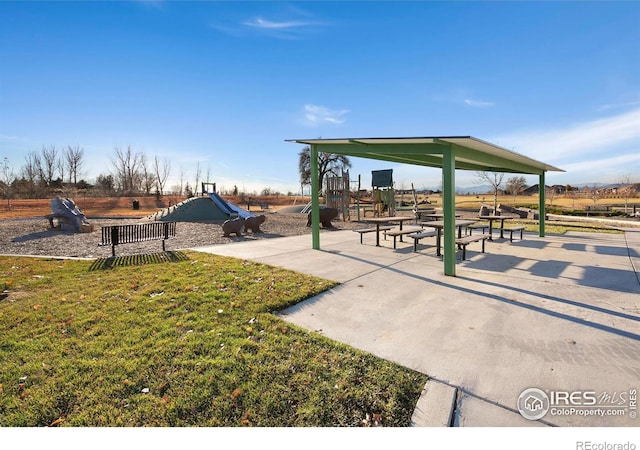 view of community with playground community and a yard