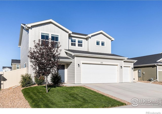 view of front facade featuring a garage, concrete driveway, fence, board and batten siding, and a front yard