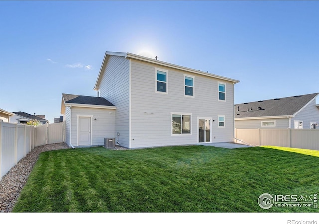 back of property featuring a patio area, a fenced backyard, central AC unit, and a lawn