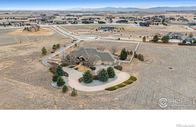 aerial view featuring a rural view and a mountain view