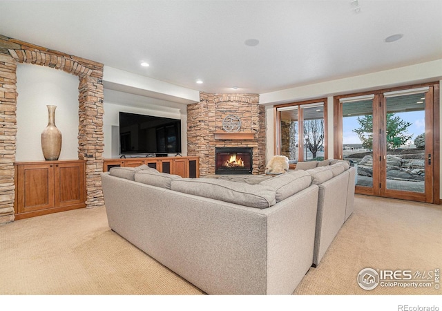 living area with light carpet, a fireplace, and recessed lighting