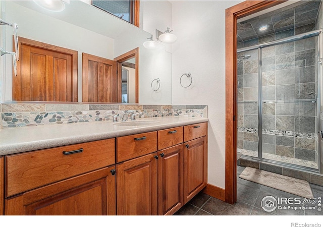 full bathroom featuring a stall shower, vanity, toilet, and tile patterned floors