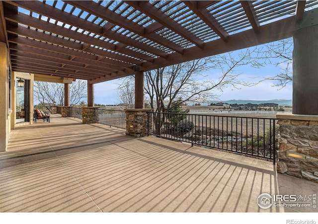 wooden deck featuring a pergola