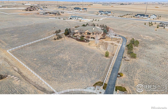 birds eye view of property featuring a rural view