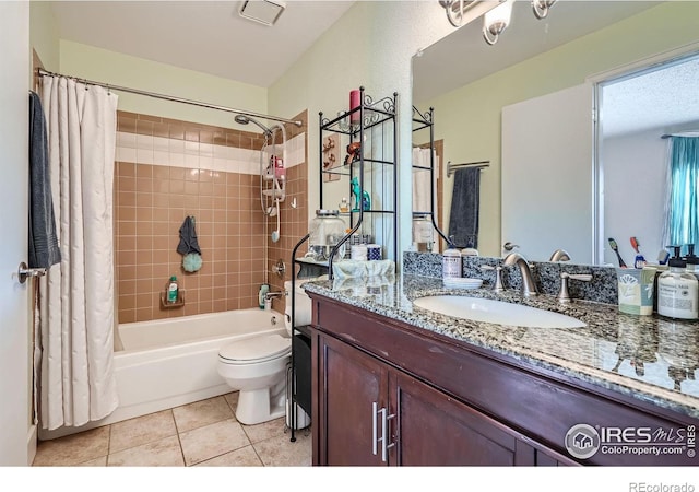 bathroom featuring tile patterned flooring, vanity, toilet, and shower / bath combo