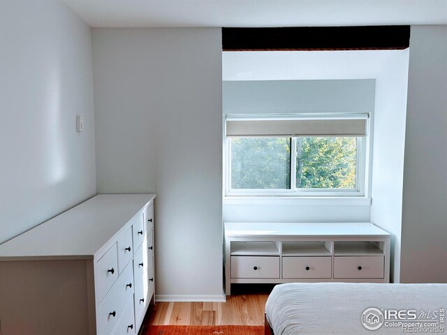 bedroom with light wood finished floors