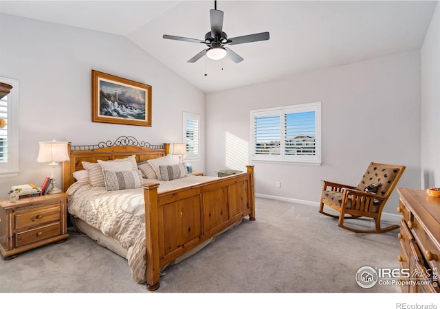 bedroom with a ceiling fan, lofted ceiling, light carpet, and baseboards