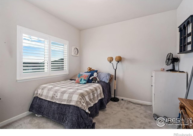 bedroom featuring carpet floors and baseboards