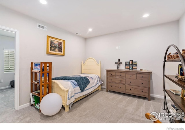 carpeted bedroom with baseboards, visible vents, and recessed lighting