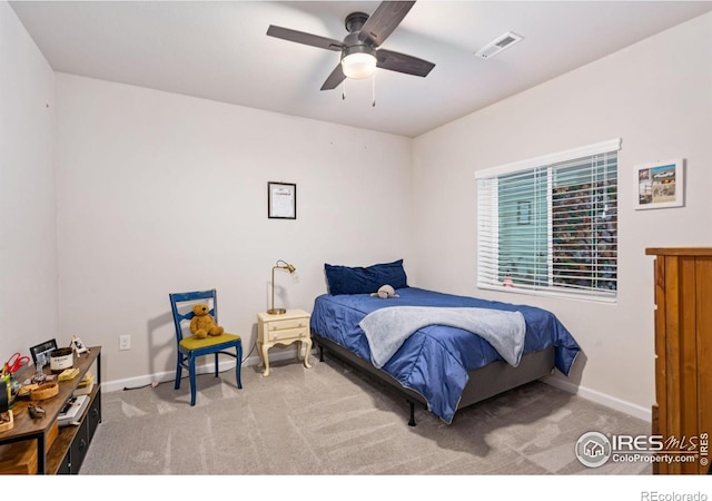 bedroom with a ceiling fan, carpet flooring, visible vents, and baseboards