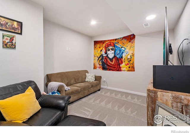 carpeted living area featuring recessed lighting, visible vents, and baseboards