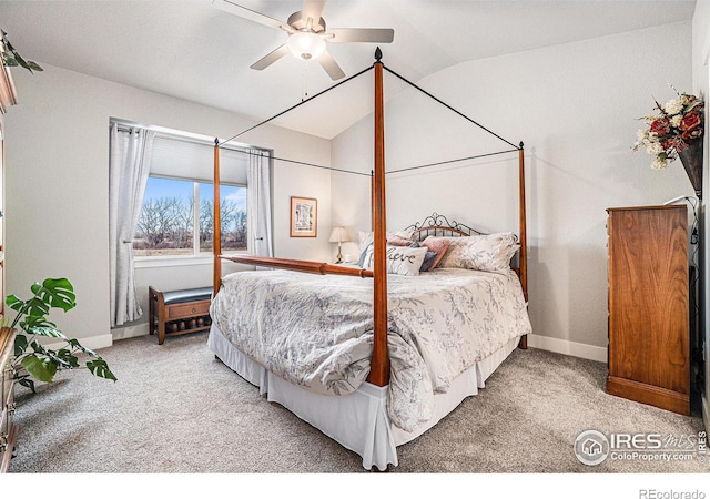 carpeted bedroom featuring a ceiling fan, vaulted ceiling, and baseboards