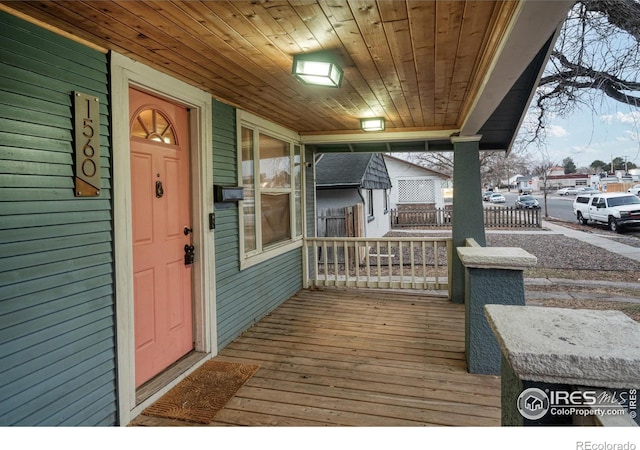 wooden deck featuring covered porch