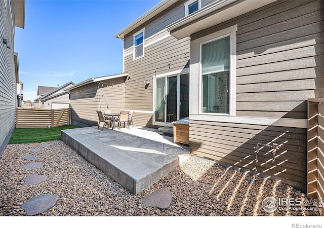 view of patio / terrace featuring fence