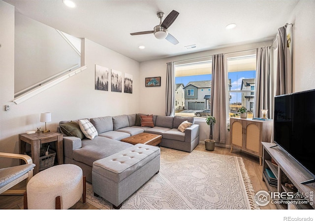 living area featuring recessed lighting, ceiling fan, and light wood-style flooring