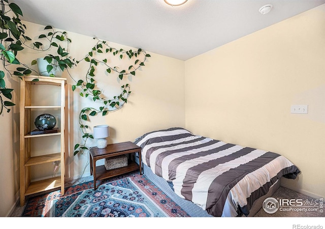 bedroom featuring baseboards