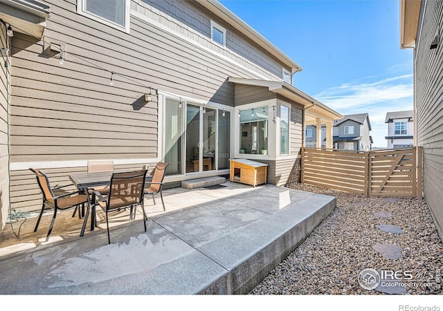 view of patio / terrace featuring fence and outdoor dining space