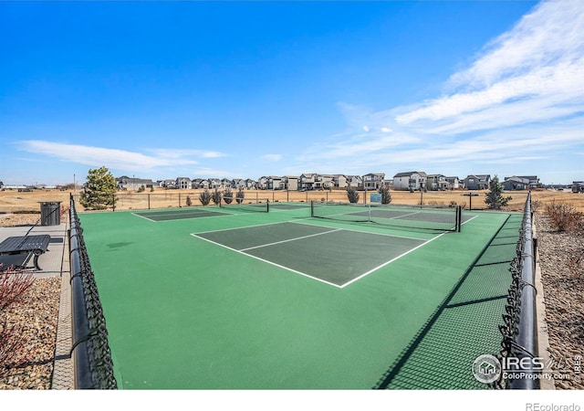 view of sport court with fence