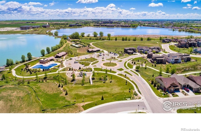 aerial view featuring a water view and a residential view