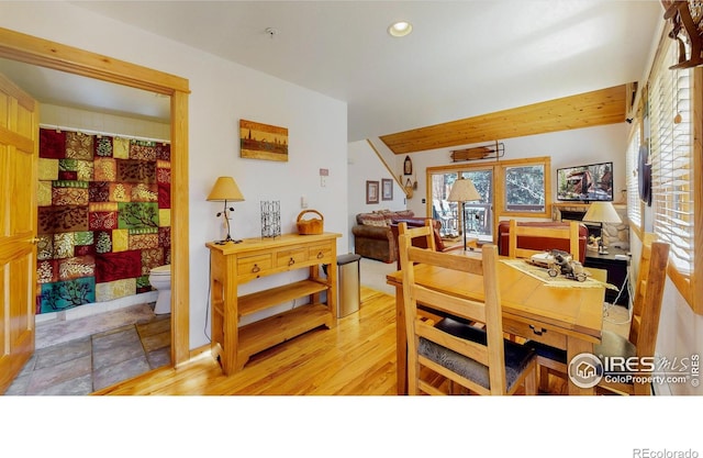 dining space with light wood finished floors and recessed lighting