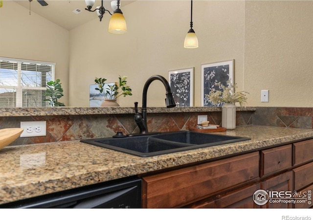 5850 Dripping Rock Ln Unit D201, Fort Collins, CO 80528 - kitchen featuring black dishwasher, decorative light fixtures, lofted ceiling, visible vents, and a sink