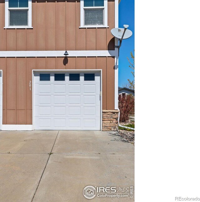 5850 Dripping Rock Ln Unit D201, Fort Collins, CO 80528 - garage featuring concrete driveway