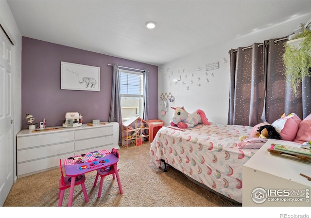 carpeted bedroom with a closet