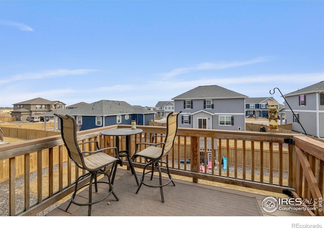 wooden deck with fence and a residential view