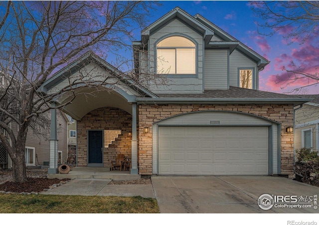 traditional-style house with concrete driveway