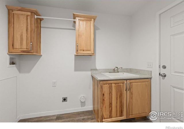 clothes washing area with washer hookup, a sink, baseboards, cabinet space, and electric dryer hookup