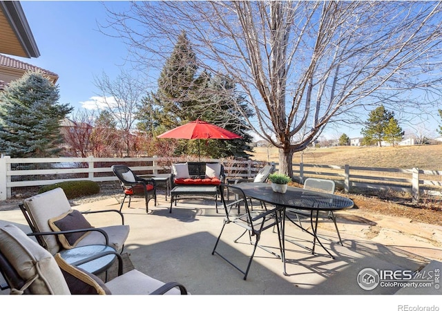 view of patio / terrace featuring outdoor dining area, fence, and outdoor lounge area