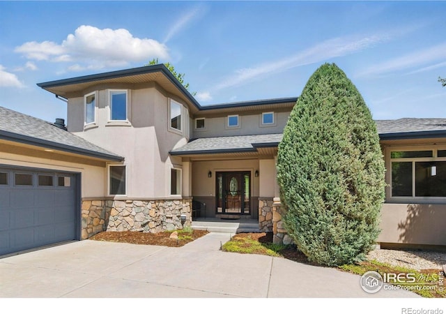 4405 Fairway Ln, Broomfield, CO 80023 - prairie-style house featuring stone siding, stucco siding, concrete driveway, roof with shingles, and a garage
