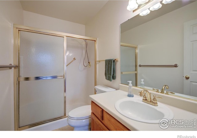 full bath with a shower stall, toilet, and vanity