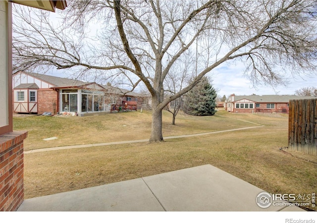 view of yard featuring a sunroom