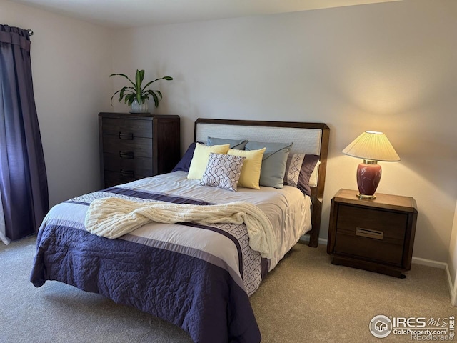 carpeted bedroom with baseboards