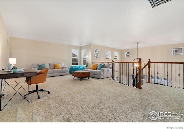 living room featuring carpet flooring and visible vents