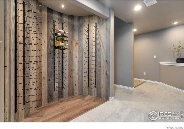 wine area with baseboards, carpet flooring, visible vents, and recessed lighting