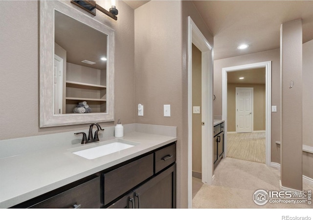 bathroom featuring recessed lighting, visible vents, and vanity