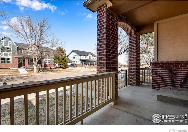 balcony featuring a porch and a residential view