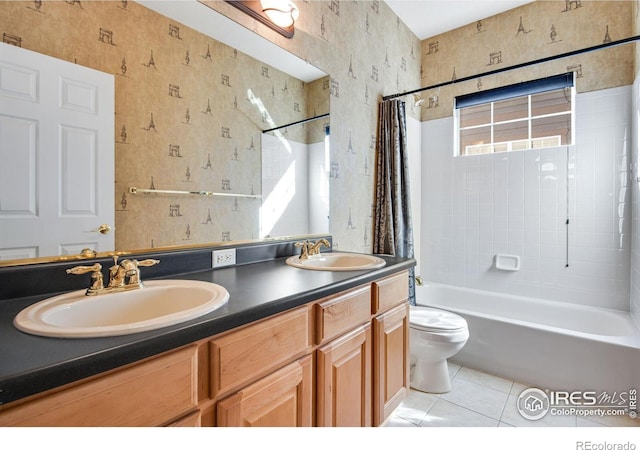 full bathroom featuring tile patterned floors, a sink, toilet, and wallpapered walls