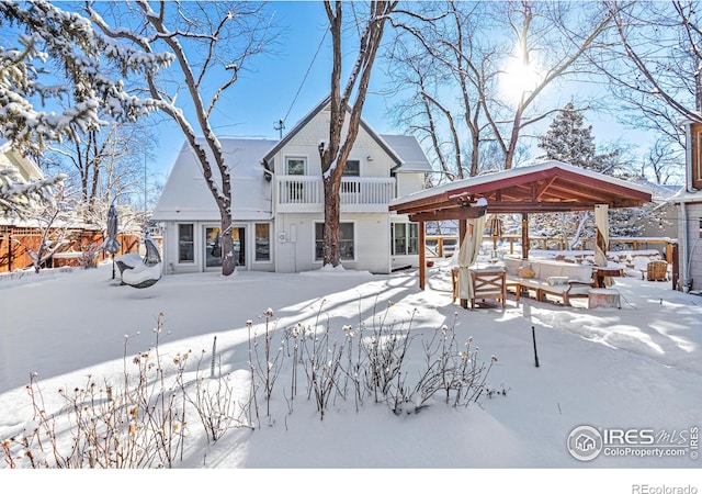 snow covered property with a gazebo