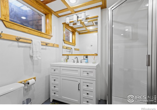 full bath with a stall shower, coffered ceiling, vanity, and toilet