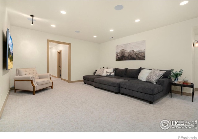 living room featuring baseboards, carpet, and recessed lighting