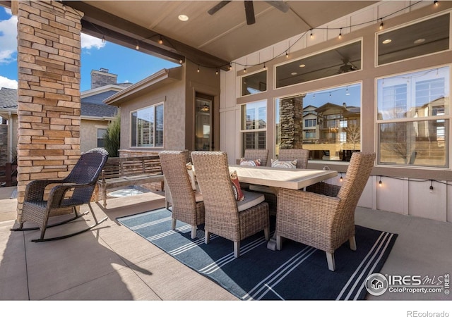 view of patio with a ceiling fan and outdoor dining area