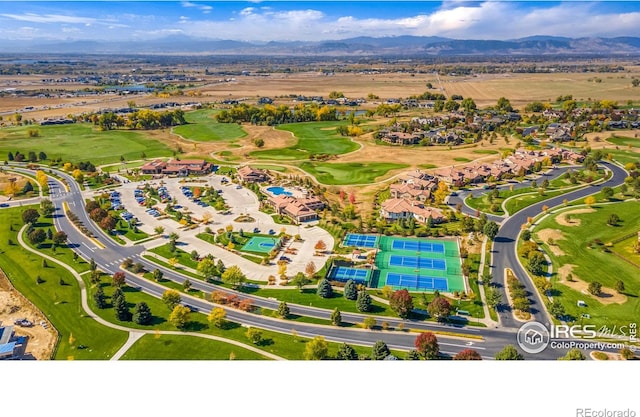 birds eye view of property featuring golf course view and a mountain view