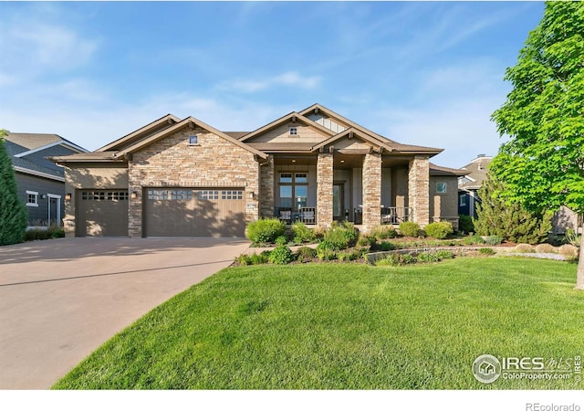 6774 Grand Park Dr, Timnath, CO 80547 - view of front of house with a front lawn, a garage, and driveway
