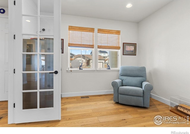 sitting room featuring recessed lighting, wood finished floors, visible vents, and baseboards