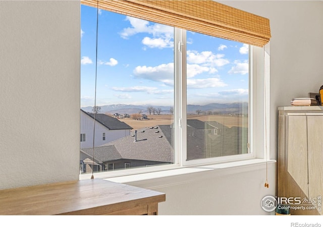 interior space featuring a residential view and a mountain view