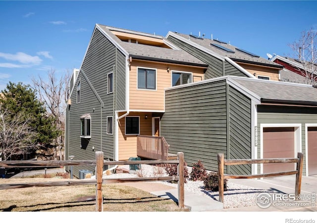 view of front of house with fence