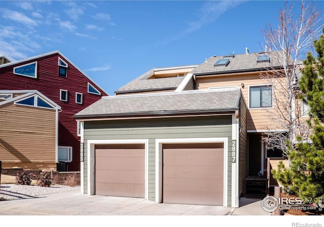 view of front of property with driveway and a garage